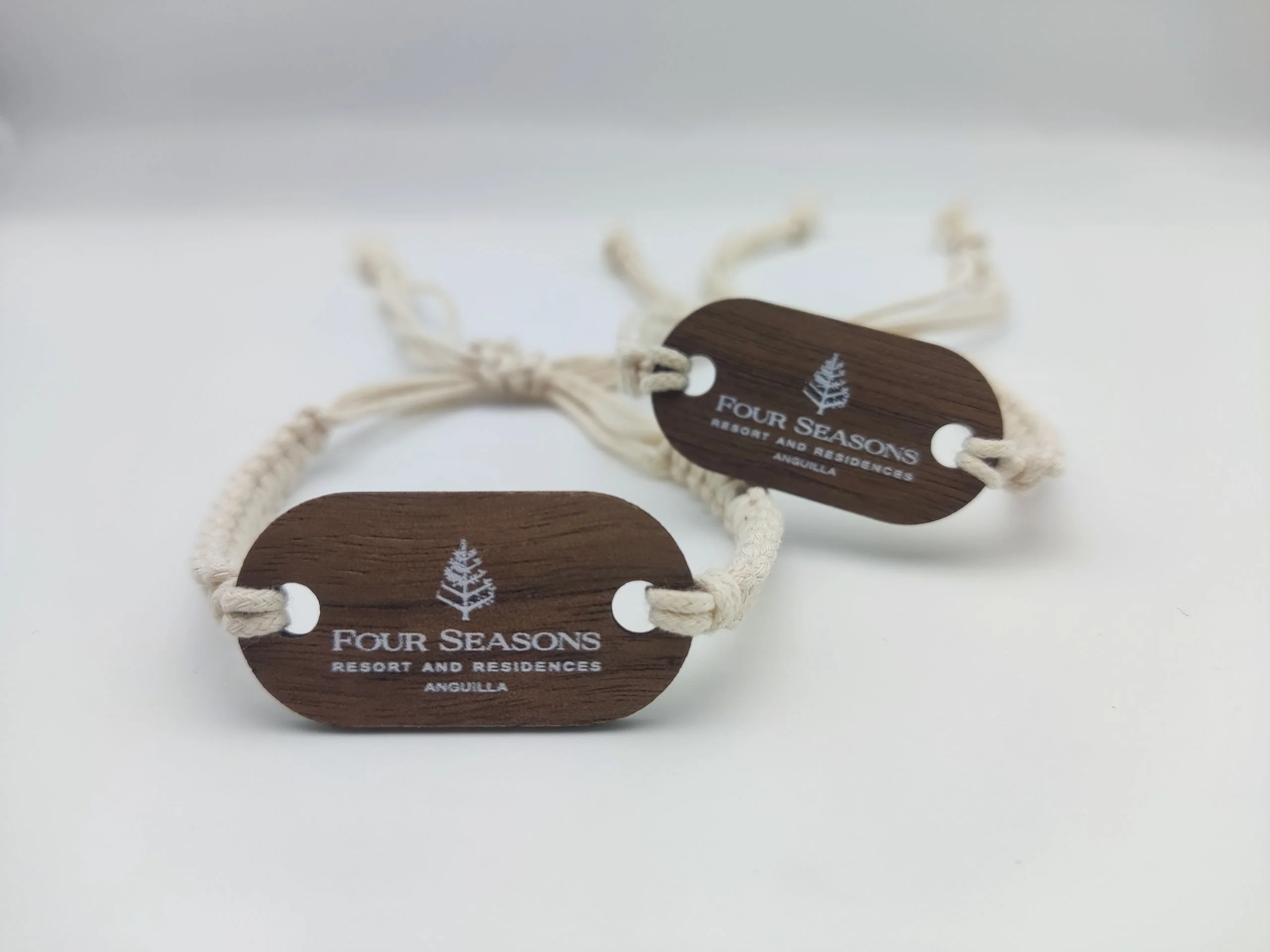 Four Seasons Anguilla wooden RFID wristband with black walnut tag and organic cotton strap
