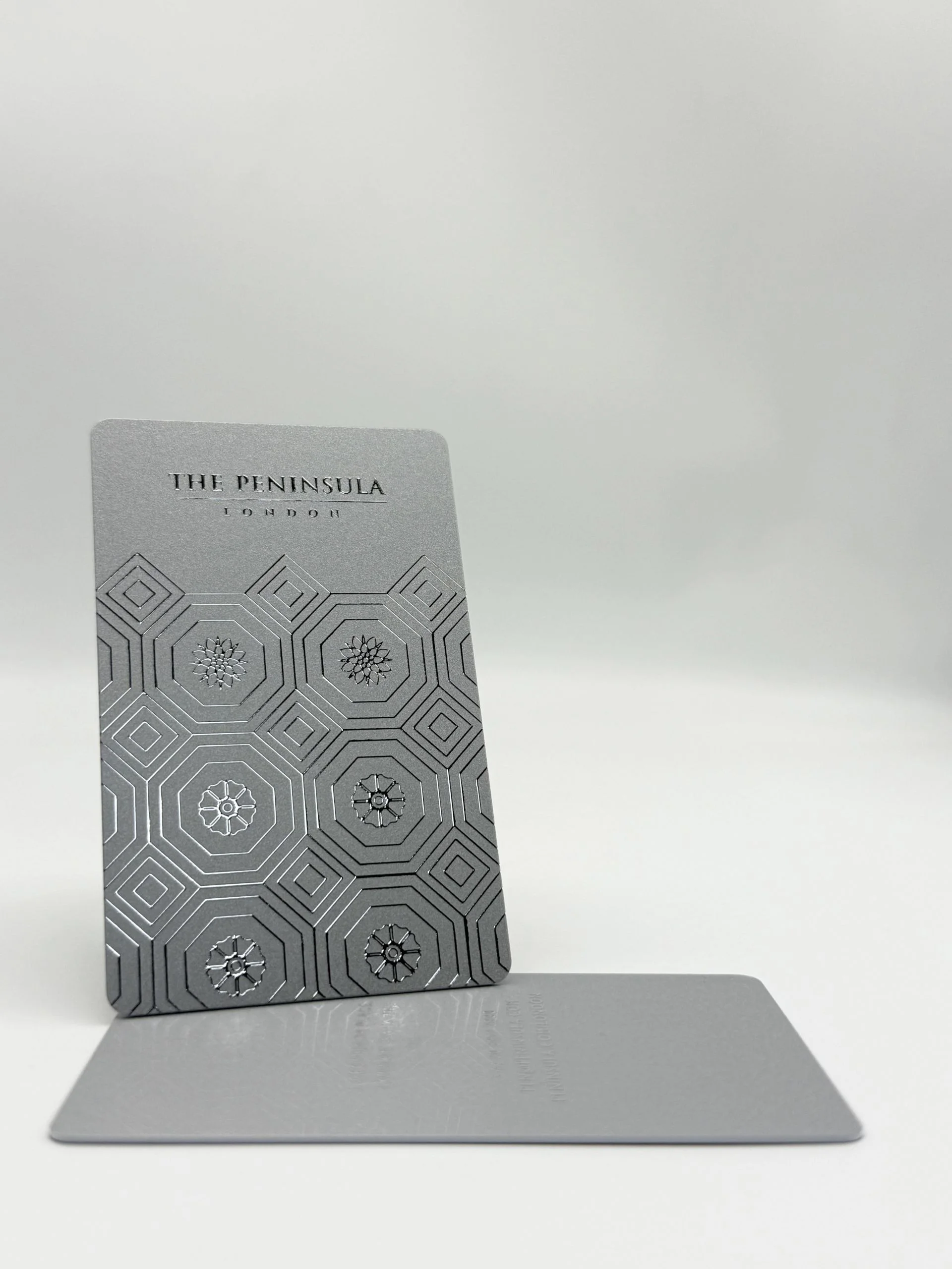 The Peninsula London silver RPVC key card featuring elegant raised branding